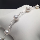 CLASSIC 7-STONE 6-7mm AAA White Freshwater Pearl Interlocking Heart Bracelet