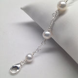 CLASSIC 7-STONE 6-7mm AAA White Freshwater Pearl Interlocking Heart Bracelet