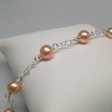 CLASSIC 7-STONE 6-7mm Naturally Peach Freshwater Pearl Interlocking Heart Bracelet
