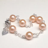 CLASSIC 7-STONE 6-7mm Naturally Peach Freshwater Pearl Interlocking Heart Bracelet