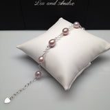 CLASSIC 7-STONE 7x8.5mm Naturally Pink Oval Freshwater Pearl Interlocking Heart Bracelet